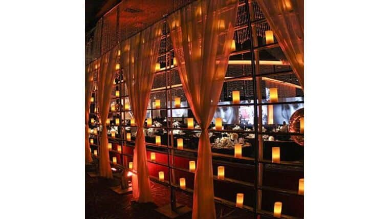 Candle Wall 5′ x 10′ – w/White Voile Drape – Gold | Rental