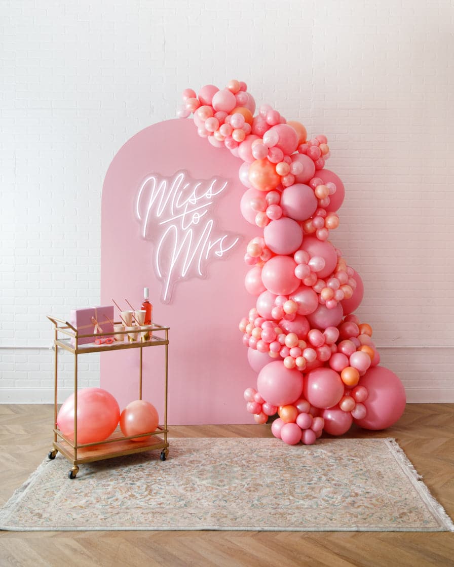 Rosé Bubbles – The Aadi Panel with Garland and Neon Sign | Rental Rosé Bubbles – The Aadi Panel with Garland and Neon Sign | Rental